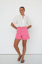 model wearing pink denim shorts by Kireina