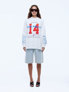 Model wearing size 8 Team Pelly long sleeve tee 172cm height