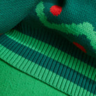 Detail view of green ribbed border edge with red dots on Tea Baby Blanket