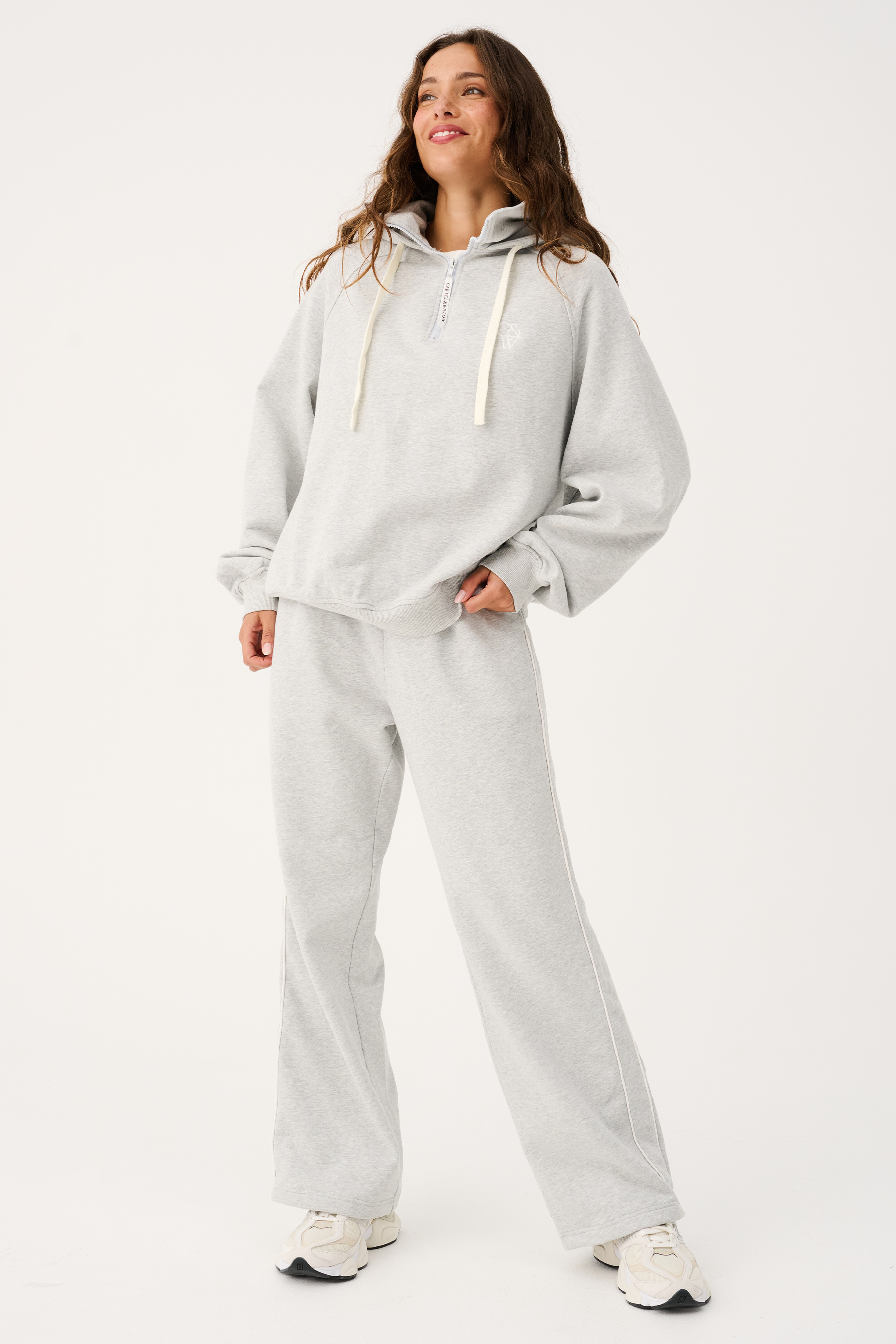 Full body front view of Teagan Hoodie and matching sweatpants in grey marle fabric