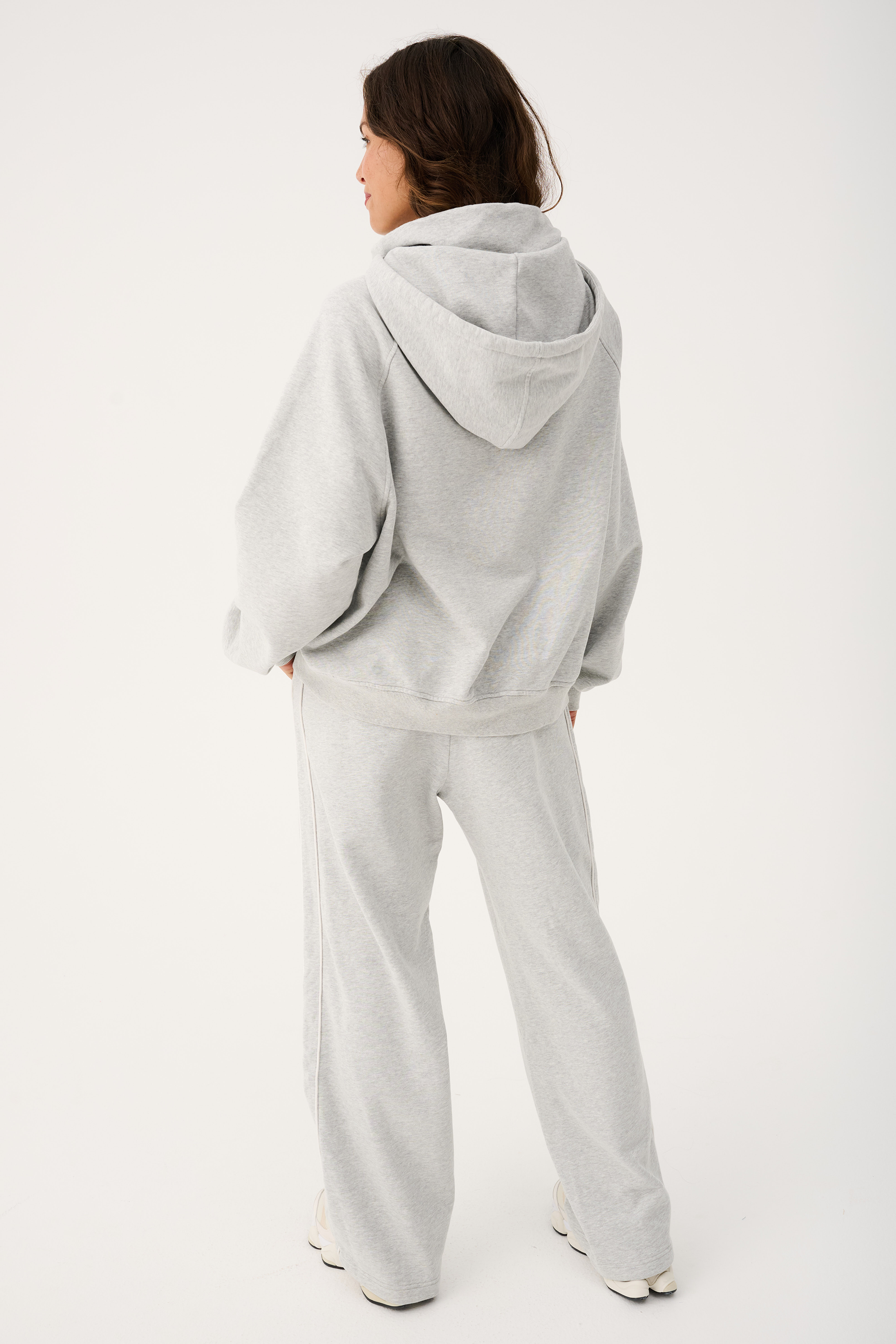 Back view of Teagan Hoodie showing hood construction and oversized fit with matching pants
