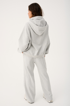 Back view of Teagan Hoodie showing hood construction and oversized fit with matching pants