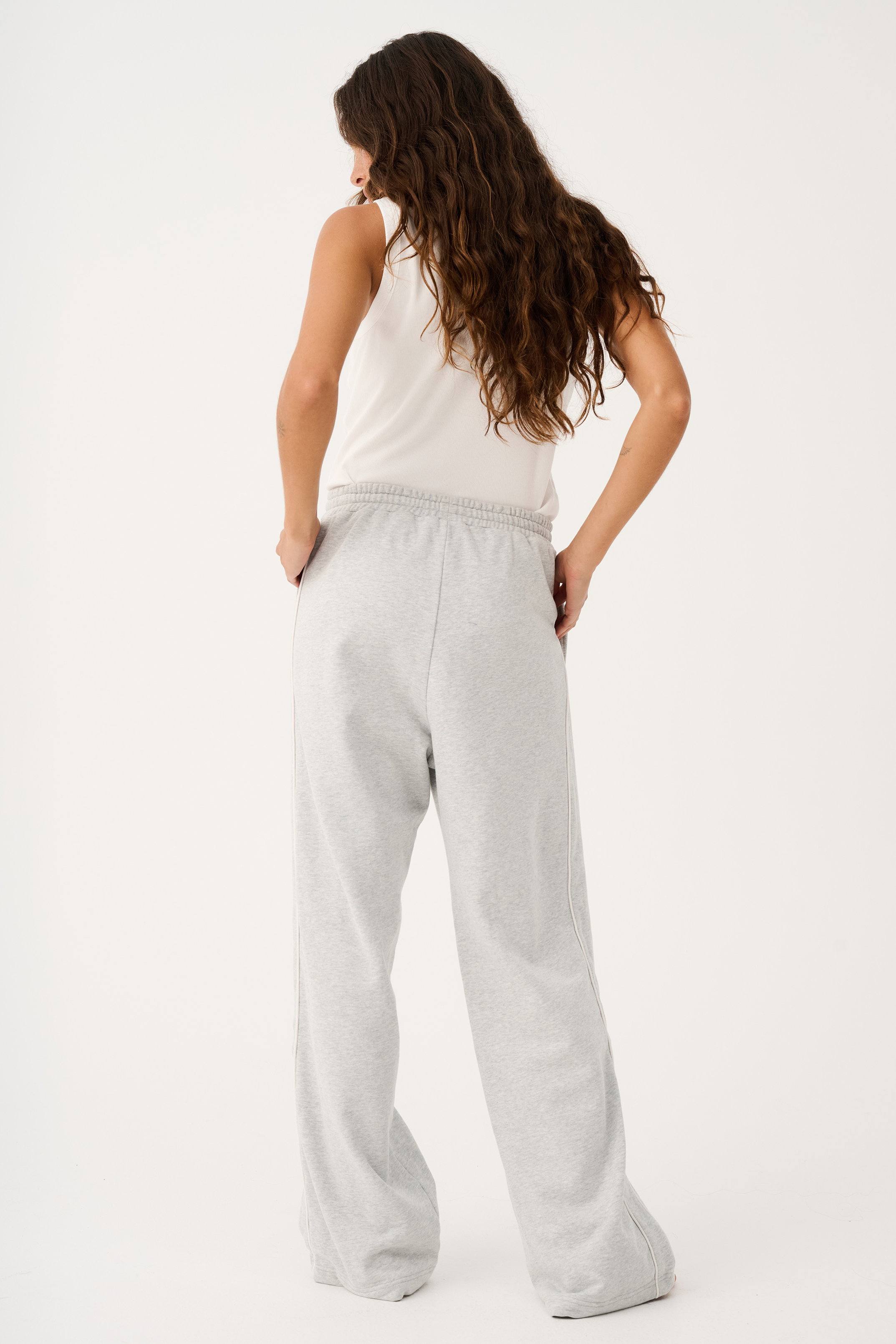 Back view of Teagan Track Pant in grey marle showing relaxed wide leg fit and elastic waistband detail