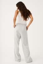 Back view of Teagan Track Pant in grey marle showing relaxed wide leg fit and elastic waistband detail