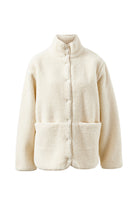 Front view of marshmallow teddy jacket showing button closure and cozy fleece texture