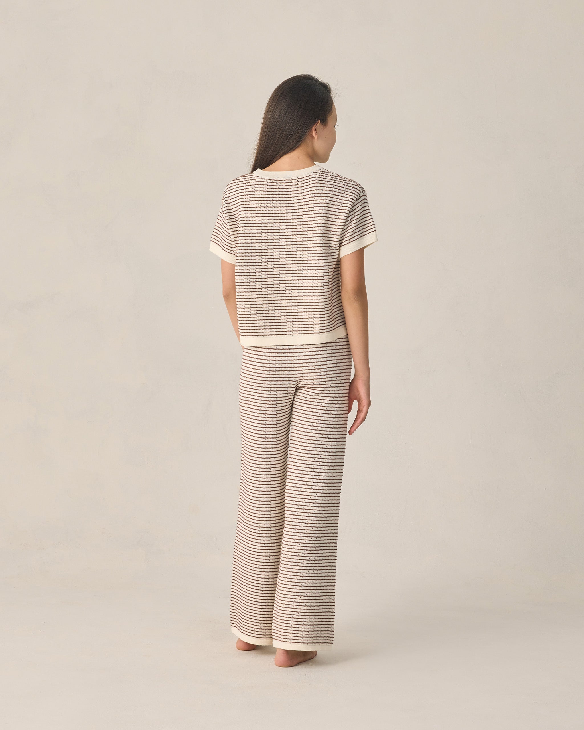 back view of teen wearing The Teen Boxy Crop Knit Tee in Chocolate Stripe by Rylee and Cru 