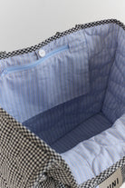 Interior view of Vichy Everything Bag showing blue striped lining and zippered pocket compartments