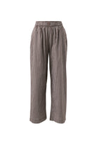 Front view flat lay of chocolate check lounge pants showing elastic waistband and relaxed fit