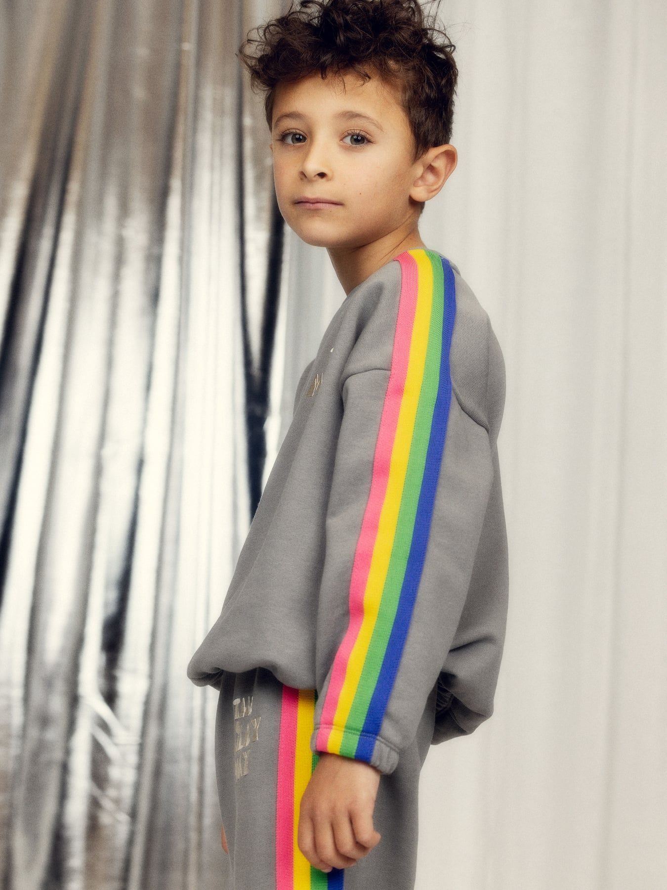 boy wearing The Milky Way Rainbow Panel Sweatshirt – Grey by Mini Rodini