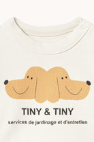 Close up of dog print on the Tiny & Tiny Baby Sweatshirt - Off-White | Tiny Cottons
