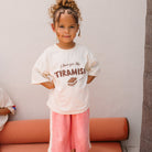 Girl wearing the Tiramisu T-shirt - Buttercream | Golden Children
