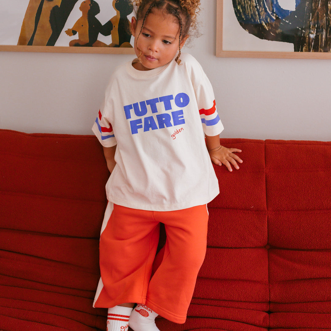 Young girl in the Tutto Fare T-shirt - Buttercream | Golden Children