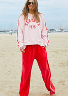 model wearing Urban Velour Pant - Red/Pink by Hammill & Co