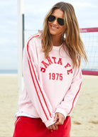 model wearing women's Urban Velour Sweat - Red/Pink by Hammill & Co