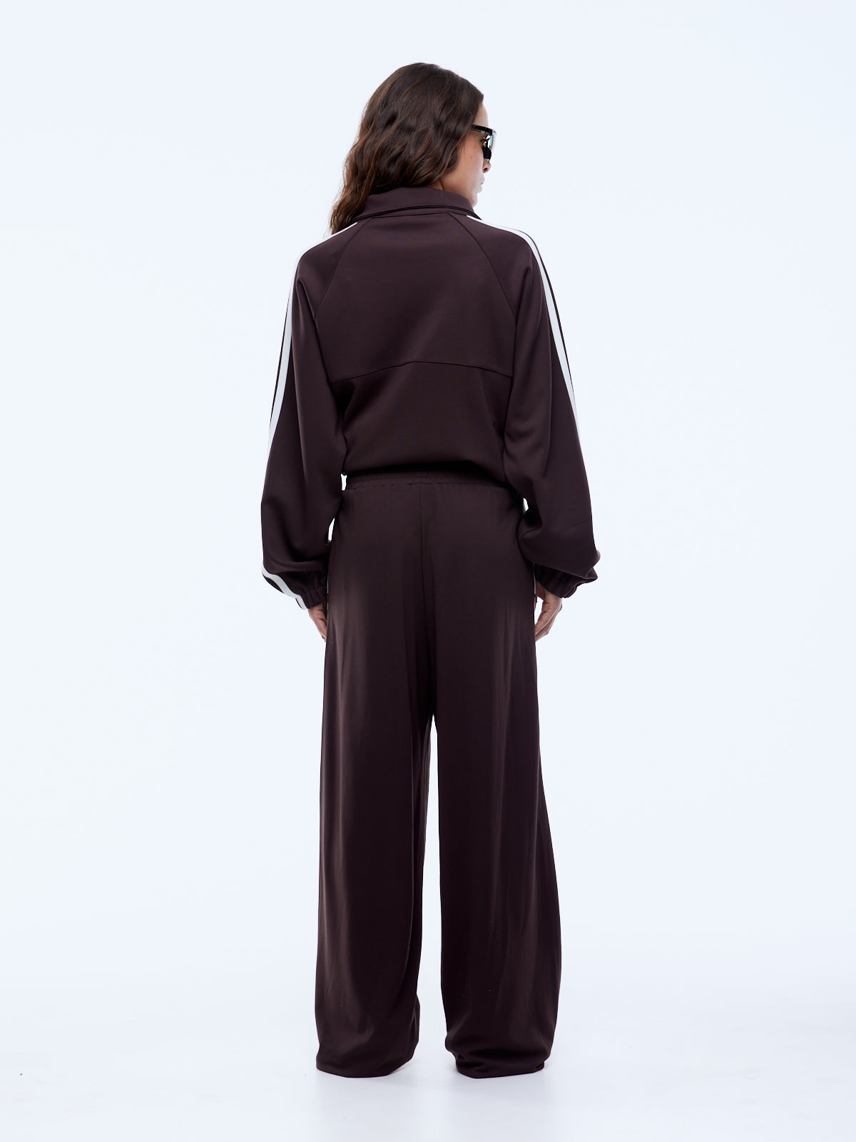 back view of Elasticated waistband and invisible zip pocket detail on Ena Pelly Valentina Stripe Pant cocoa