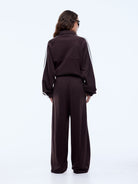 back view of Elasticated waistband and invisible zip pocket detail on Ena Pelly Valentina Stripe Pant cocoa