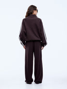 Welt pockets and stacked Ena Pelly logo prints detail on cocoa utility zip jacket