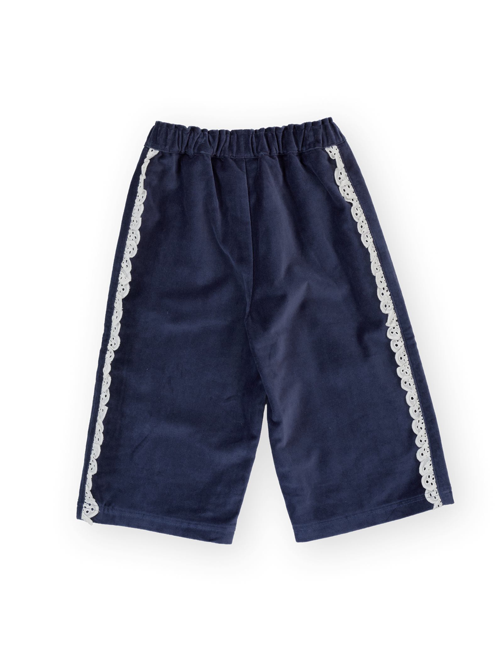 Flat lay of navy velour broderie wide leg pants showing elastic waist and white lace trim