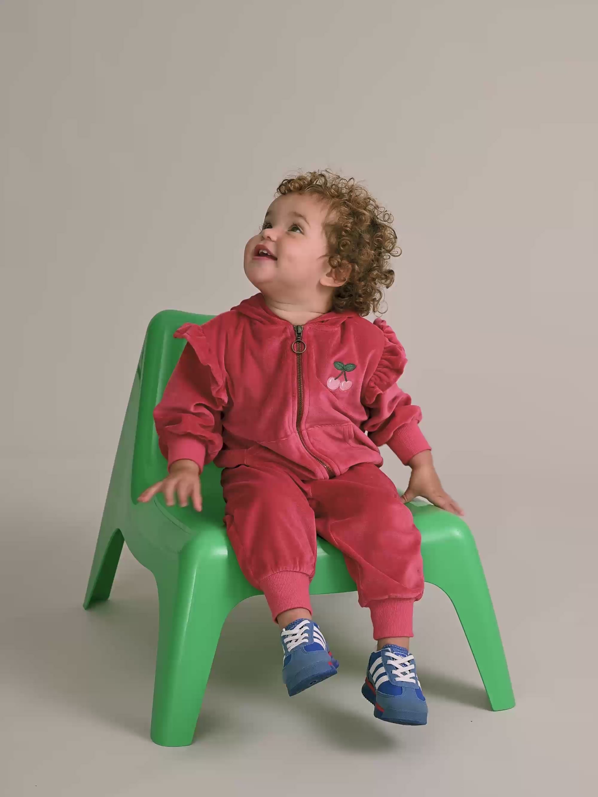 Young child wearing the matching set to the Very Cherry Velour Trackpant | Huxbaby