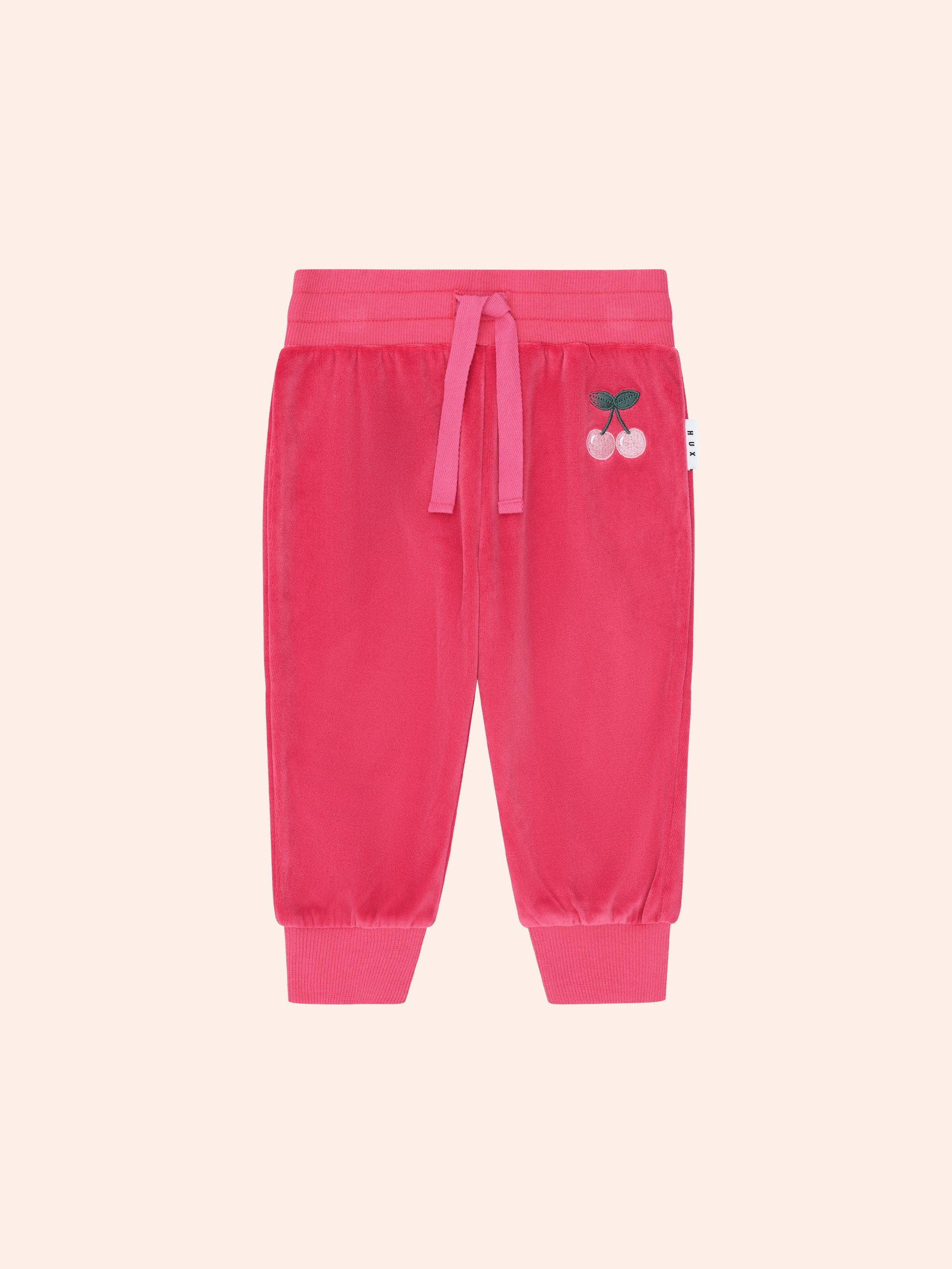 Front view of the Very Cherry Velour Trackpant | Huxbaby