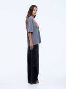 side detail of bold plastisol watermelon graphic on grey cotton tee