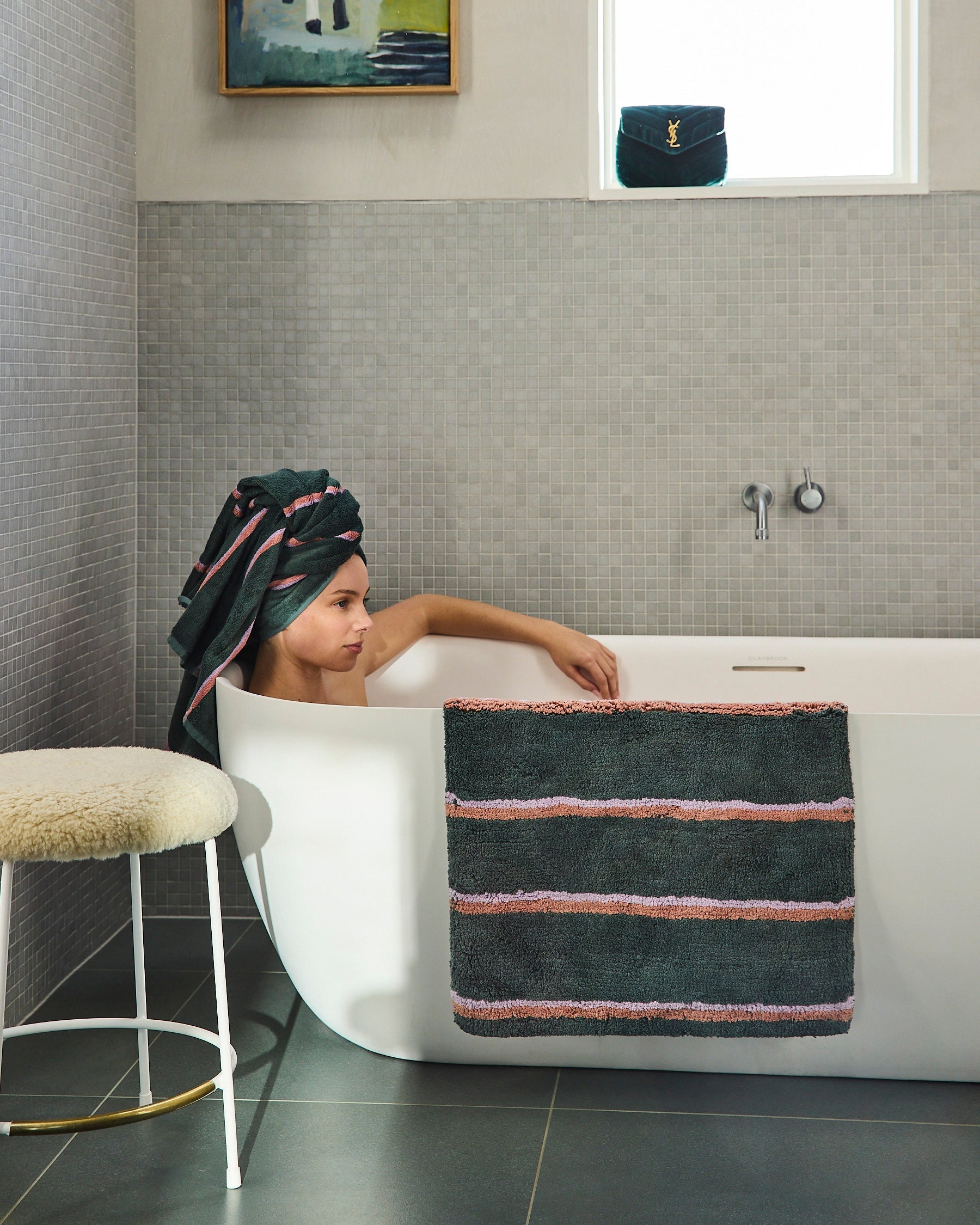 Woman in bathtub with green striped bamboo terry bath sheet and matching hair wrap towel