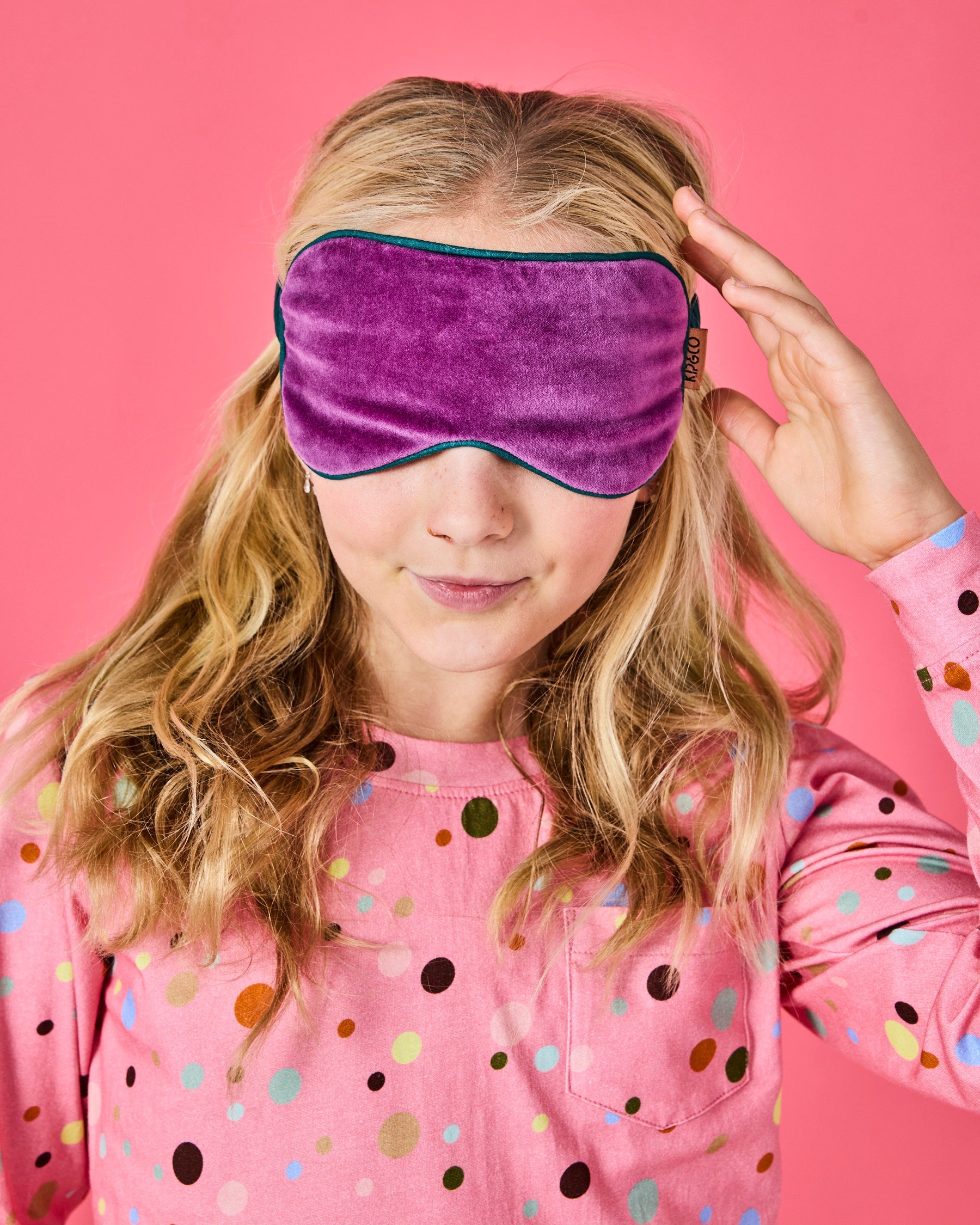 Front view of Wild Grape Velvet Eye Mask by Kip & Co showing purple velvet fabric and elastic strap