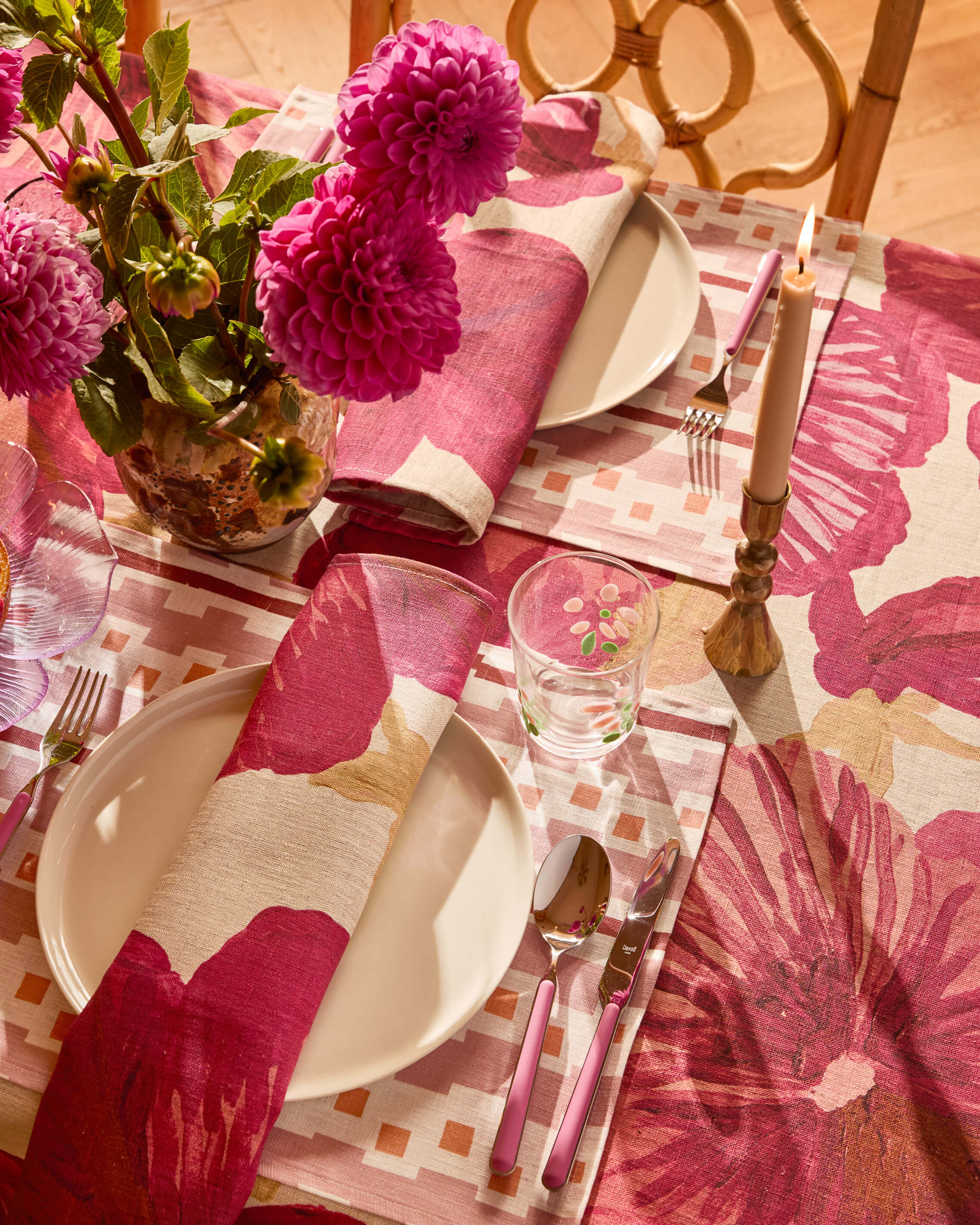 Close-up of Wild Pansy Pink napkin showing detailed floral pattern and checkered border design