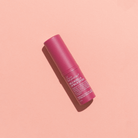 We are Feel Good Wild Rosella Lip Balm SPF50 being applied to lips for sun protection