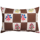 Back view of brown and cream checkerboard cotton pillowcase with colorful folk floral print, showing label