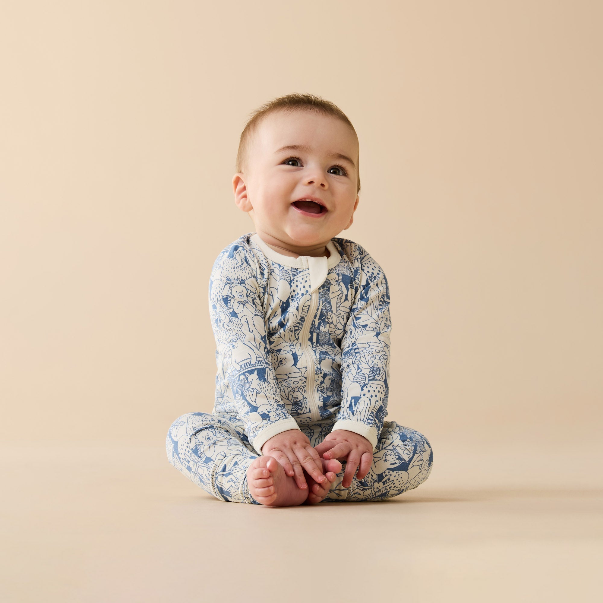 Baby wearing the Woodland Adventures Organic Zipsuit With Feet | Wilson + Frenchy