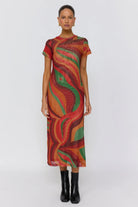 Front view of Yoko Midi Dress showing vibrant swirl pattern in red orange and green tones