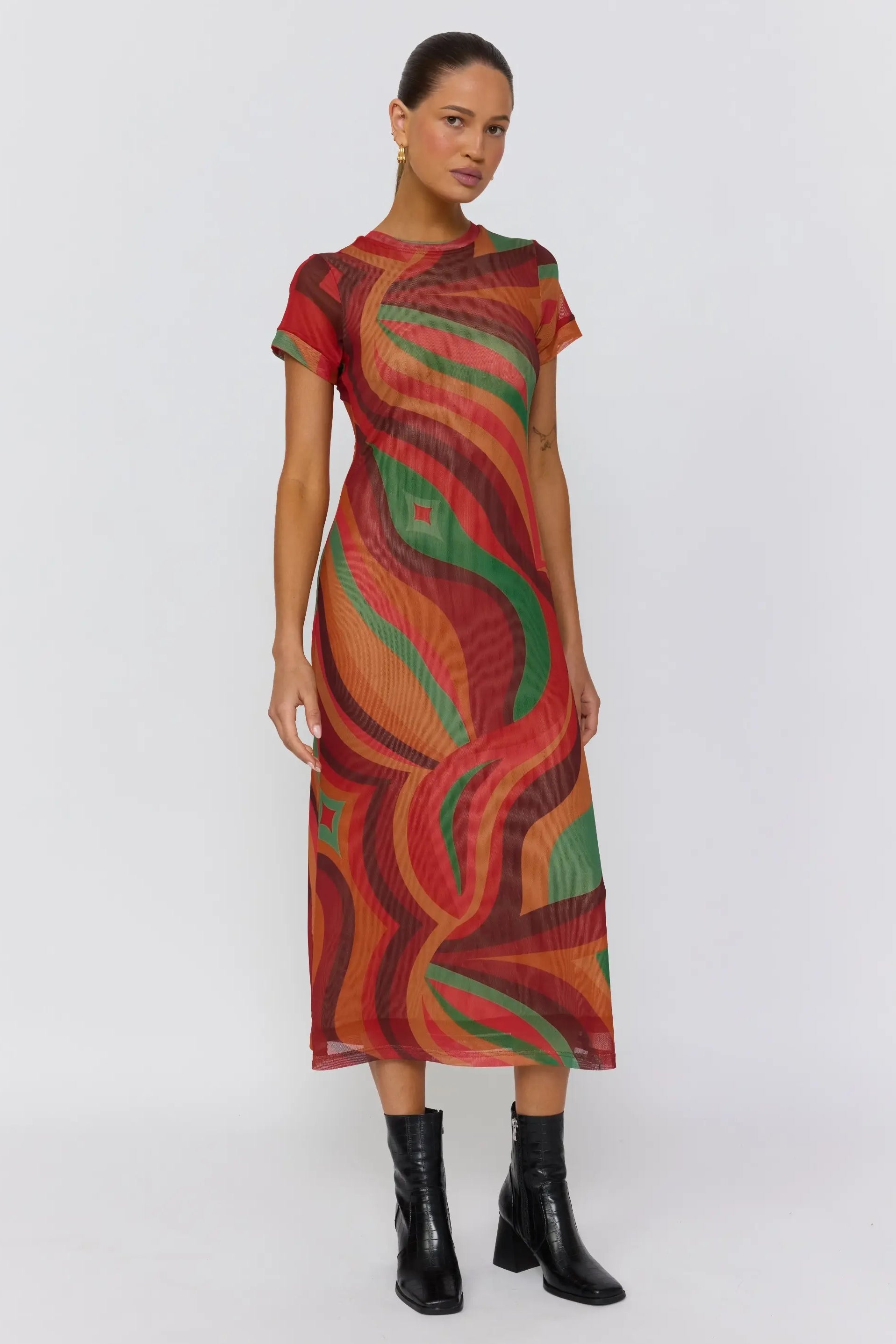 Side angle of Yoko Midi Dress showcasing curved wave print and semi sheer fabric