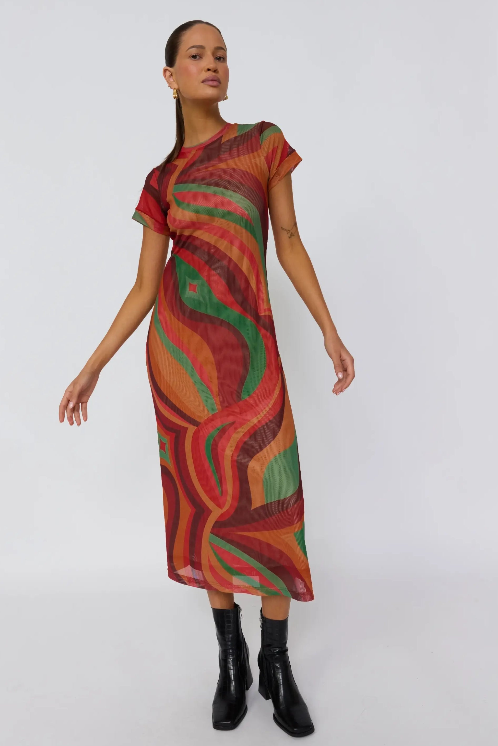 Dynamic side pose of Yoko Midi Dress highlighting fluid drape and vibrant crimson sun print