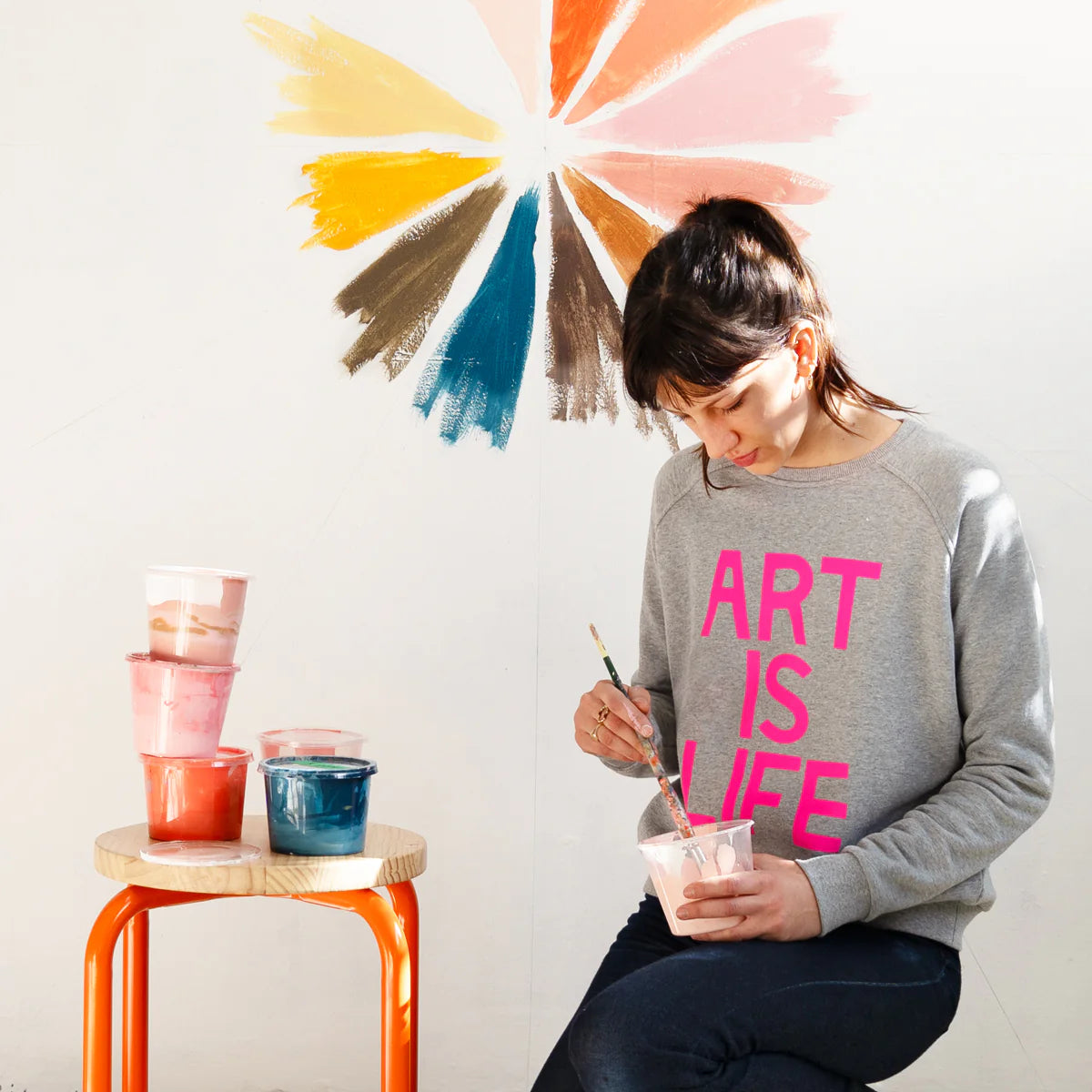 Grey Marle fleece sweater with bright pink text ART IS LIFE