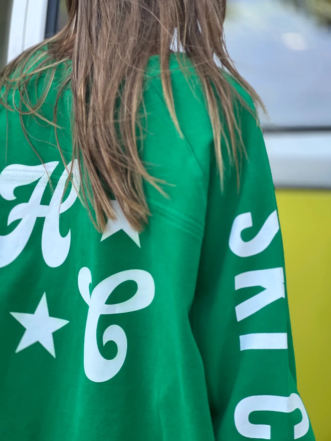 back detail of green oversized ski jumper by Hammill & Co
