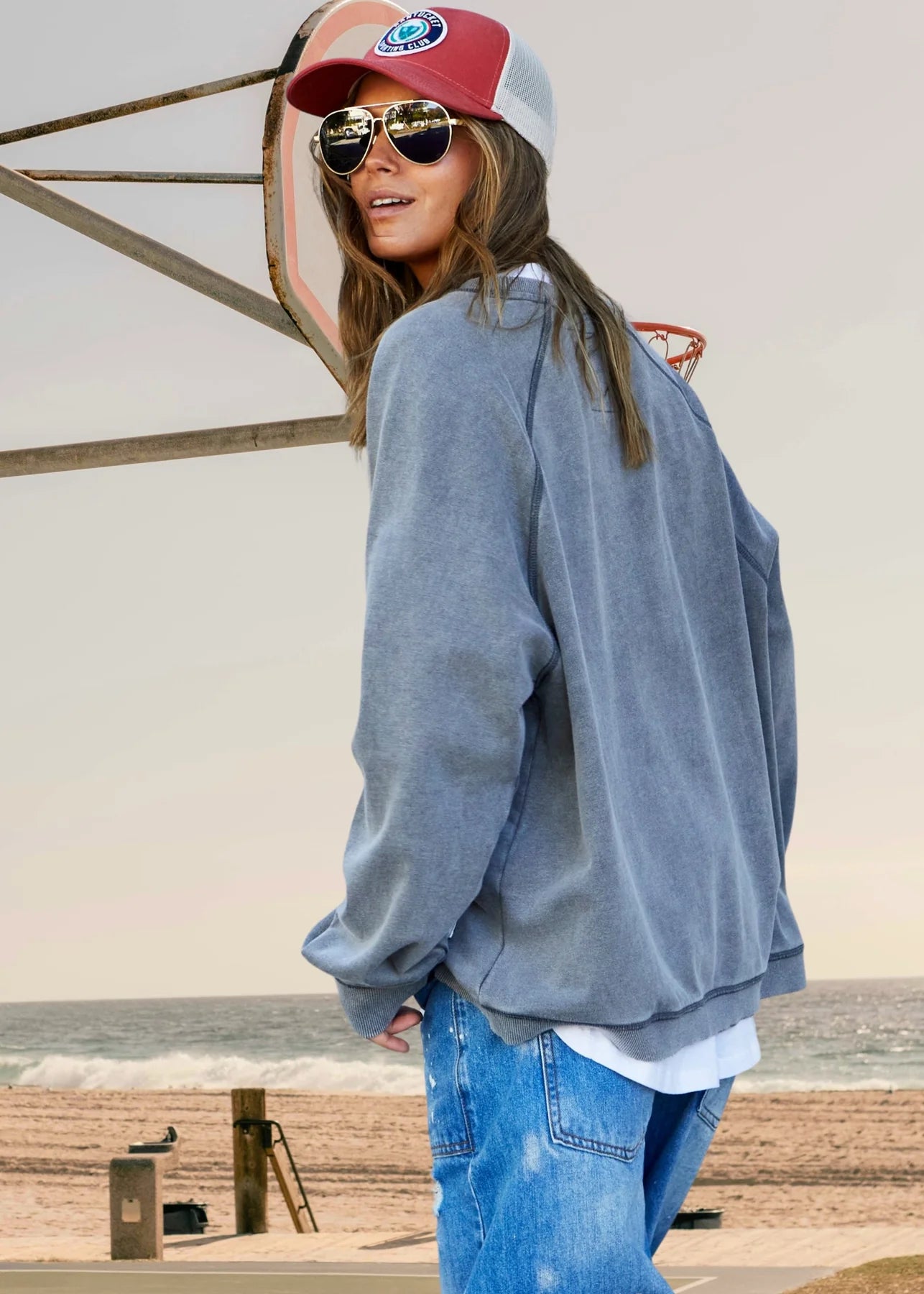 back of model wearing Howdy Cowboy vintage wash sweats black by Hammill & Co