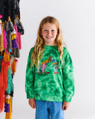 Young girl wearing Kip&Co X May Gibb Kangaroo Tie Dye Sweater