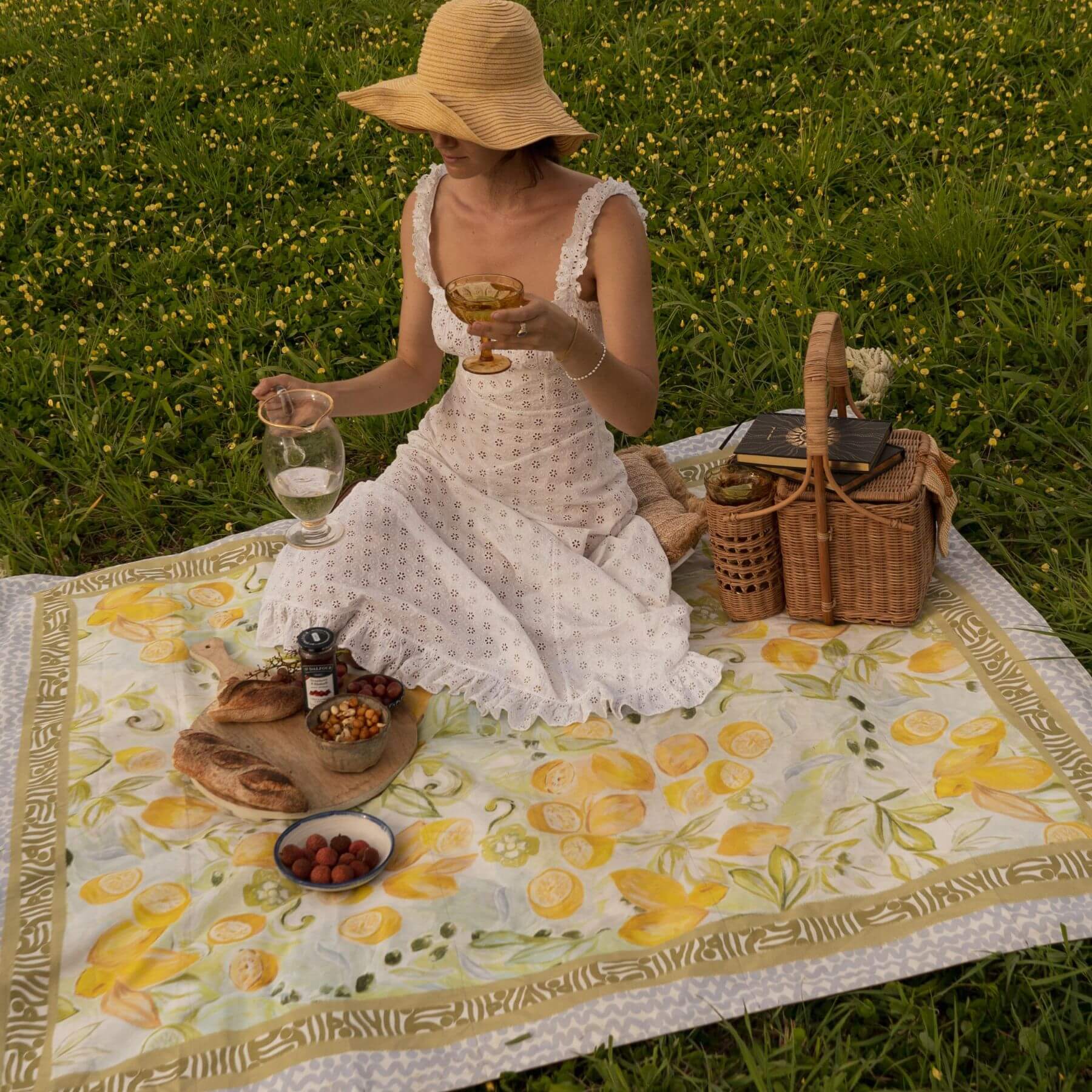 Lovely lady having a picnic on the Wandering Folk Le Lemon picnic rug