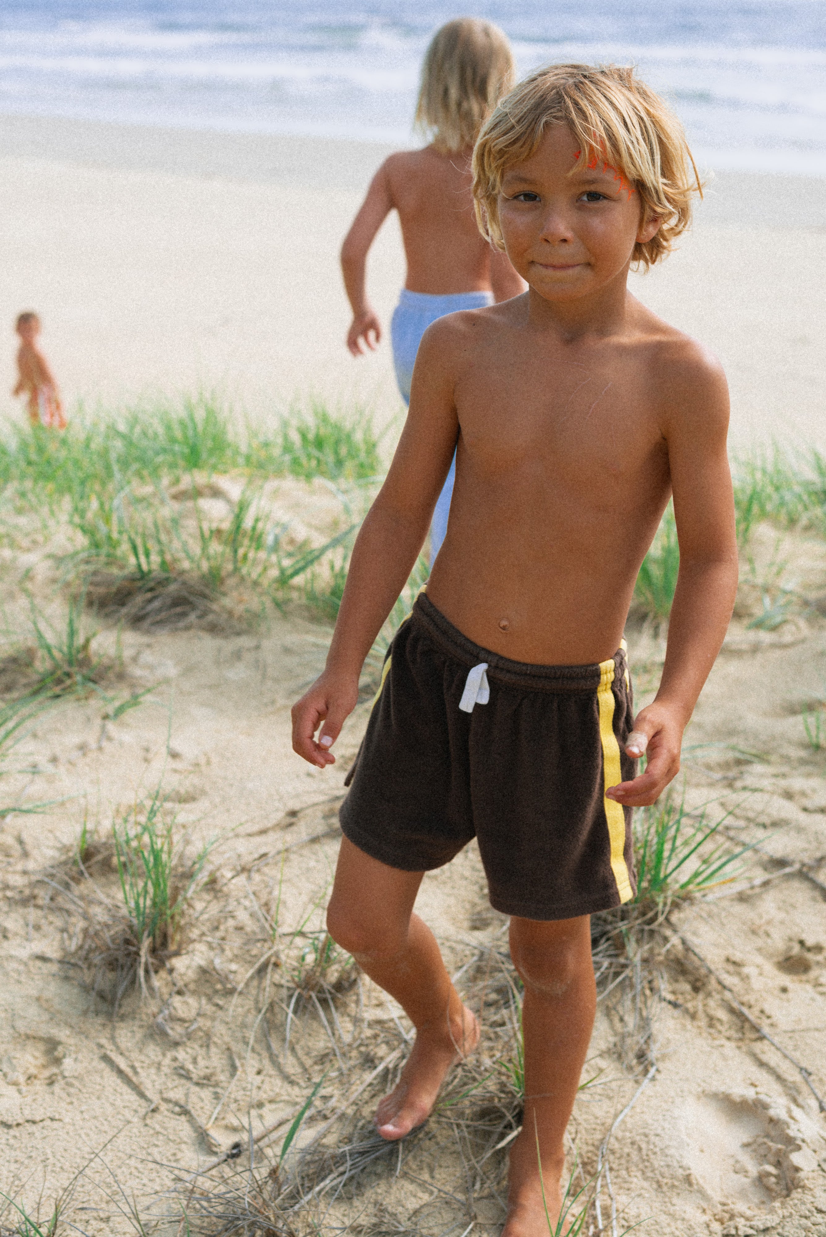 Boy wearing brown terry shorts by Atmosea
