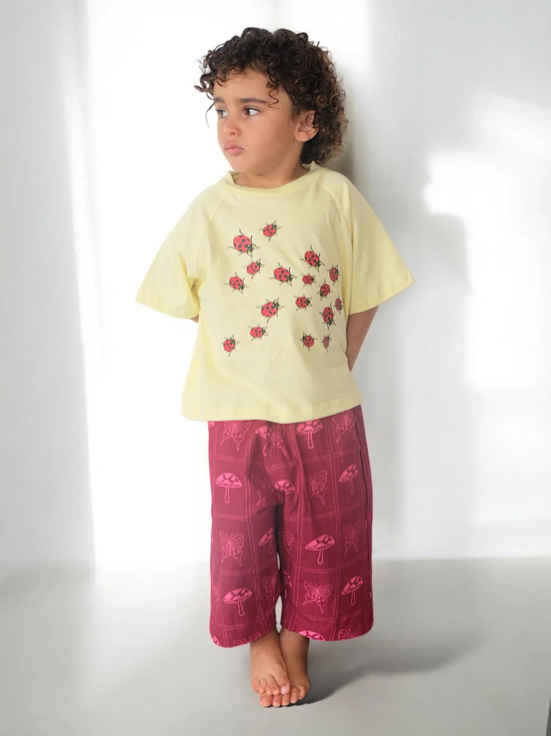 girls canvas pants in red pink cerise with mushroom and butterfly print