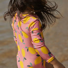 girl wearing One Piece Bathing Trunks Lemmony Rose by Nature Baby