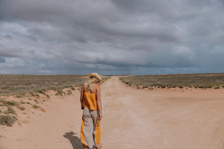 lady wearing yellow and brown patchwork pants by Atmosea