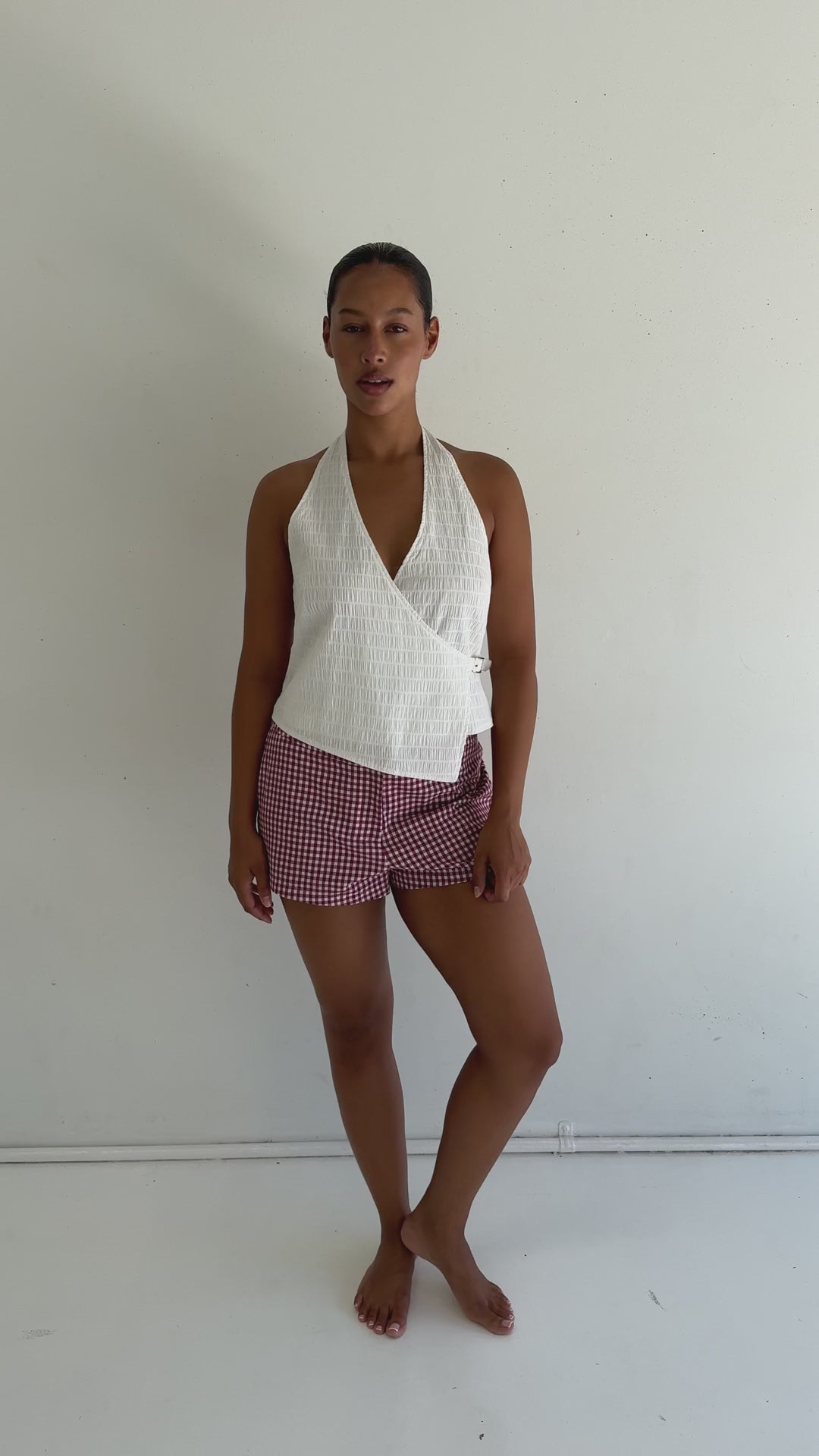 video of model wearing June Tailored Short - Cherry Gingham by Juni