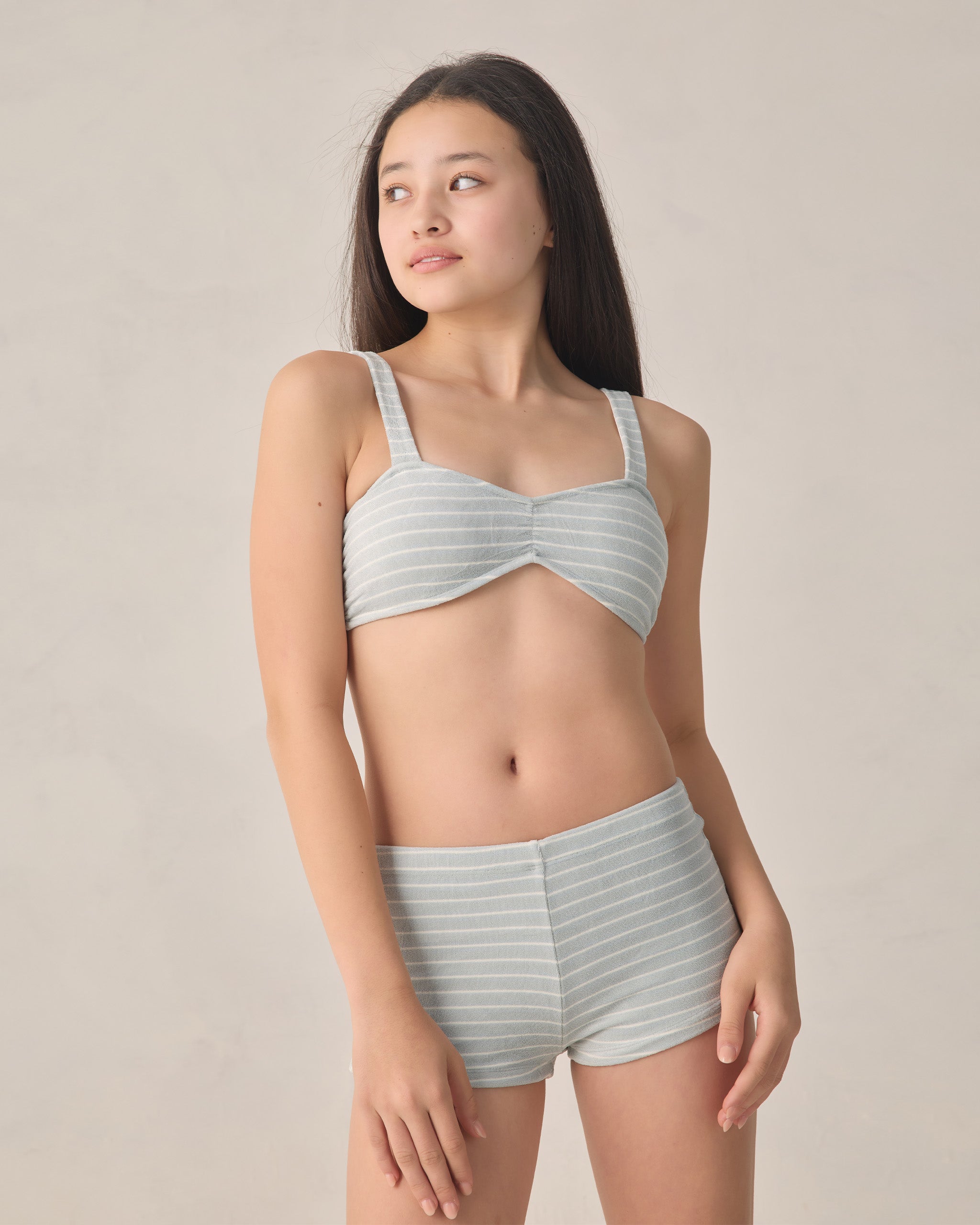teen girl wearing blue and white stripe bikini by Rylee & Cru