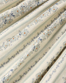 fabric detail of girl wearing Teen Daria Mini Dress Blue Floral by Rylee + Cru