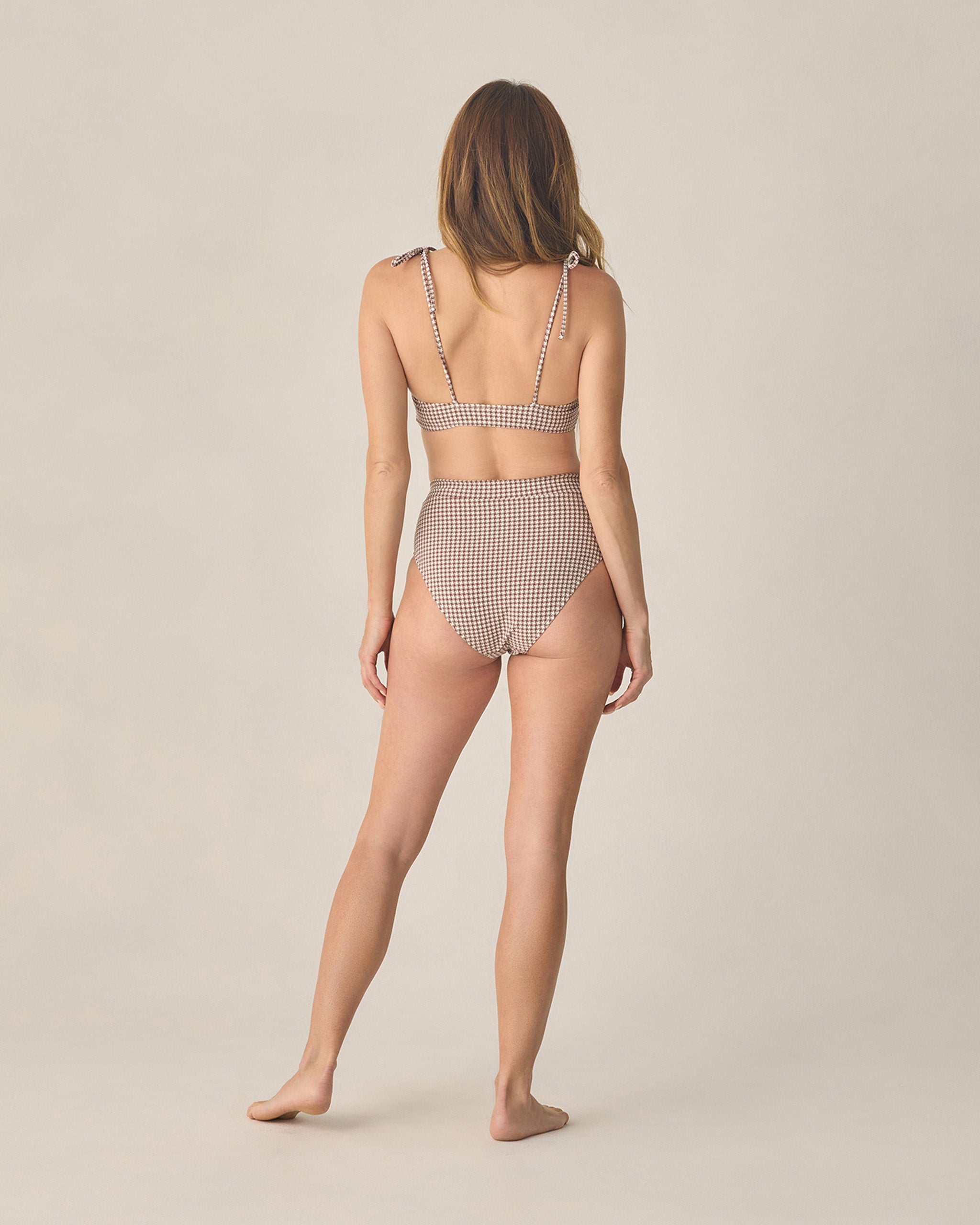 back view of lady wearing Women's Alba Bikini Top Chocolate Houndstooth by Rylee Cru